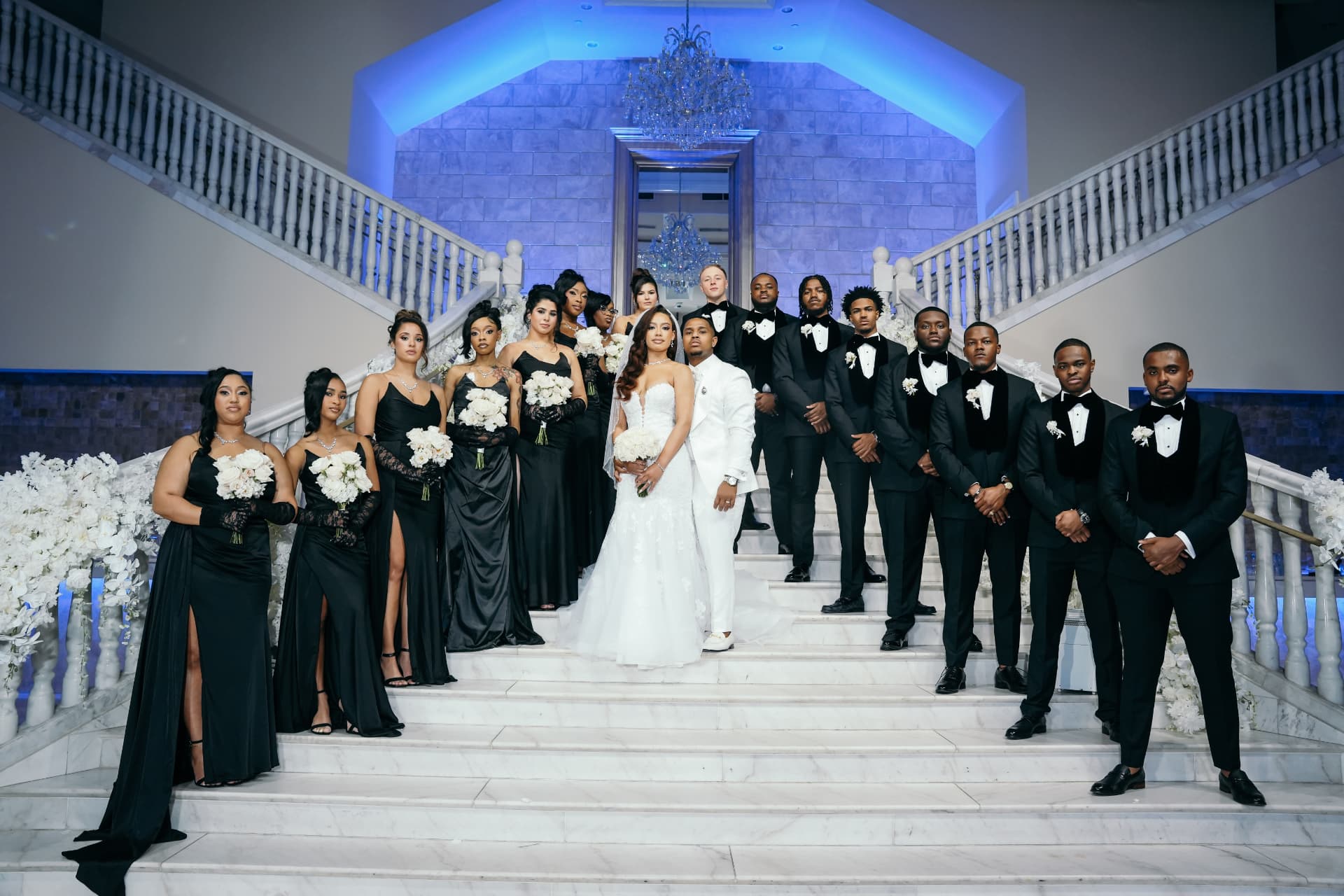 Bridal party on a grand marble staircase